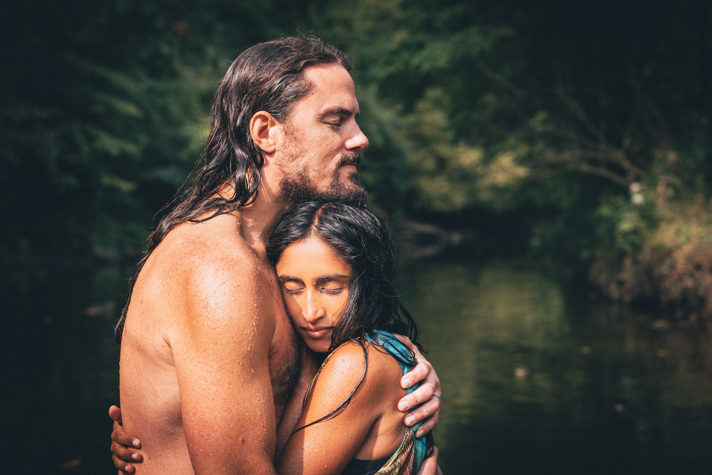 Shivani and Garret Rhea embracing in nature
