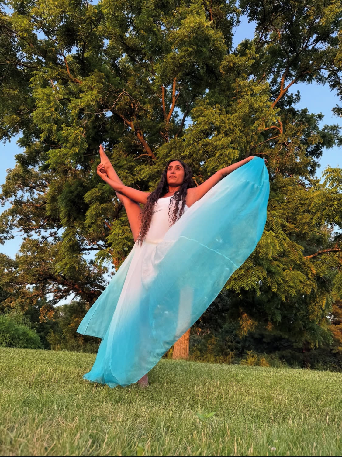 Shivani Rhea dancing in an open field