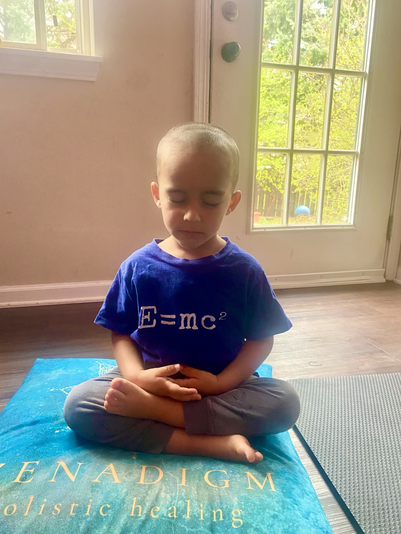 A young student in seated meditation